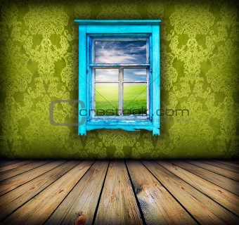 green room with window with field and sky above it 