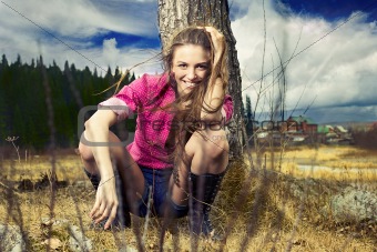 Fashion portrait of young beautiful woman in nature