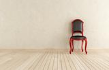 red and black classici chair against wall