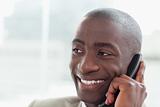 Close up of a happy businessman on the phone