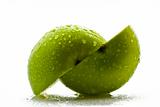 Two green apple halfs over white background