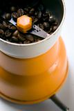 Grain coffee in a grinder