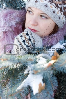 Beautiful girl in hat and mittens