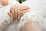 Bridal manicure and garter