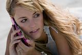Young blonde woman talking with mobile-phone