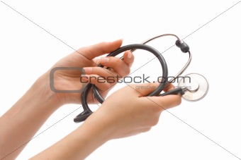 Stethoscope in female hands, isolated over white