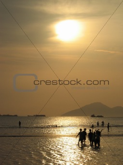 friends on sunset beach