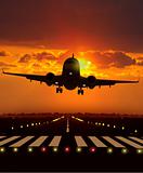 airplane take off during sunset