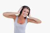 Happy woman dancing while listening to music