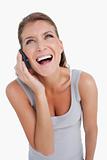 Portrait of a delighted woman making a phone call