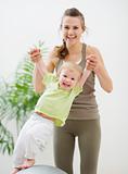 Mother and baby having fun in gym