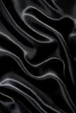 Smooth elegant black silk as background 