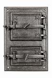 the traditional iron door to the tile stove