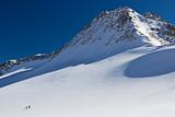 ski-alpinists on a glacier in the Alps