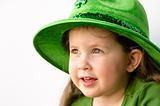 Pretty little girl with greent hat
