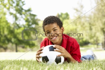Boy In Park With Football