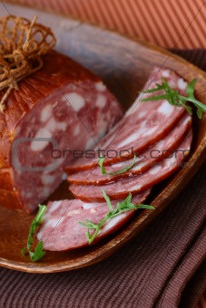 luxury brand smoked sausage on a wooden board