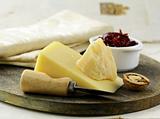 cheese platter with nuts and jam