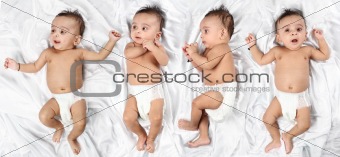 Baby in 4 different expressions on white satin background