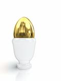Golden egg in egg cup isolated on white background.