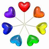 Seven heart shaped lollipops colored as rainbow