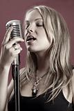 Gorgeous singer and vintage microphone