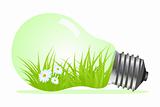 Light bulb with plant and grass