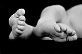 The bare feet of a new born baby