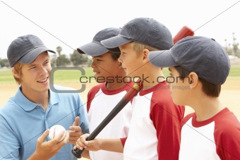Young Boys In Baseball Team With Coach
