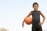 Young Boy Playing Basketball