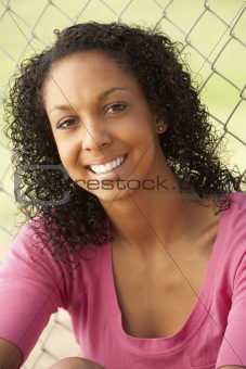 Teenage Girl Sitting In Playground