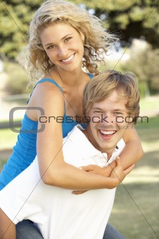 Teenage Couple Having Fun In Playground