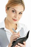 Blonde Businesswoman Writing In Diary