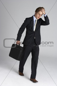 Worried Looking Executive With Briefcase