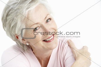 Studio Portrait Of Smiling Senior Woman