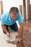 Builder Laying Wooden Flooring