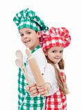Happy chef kids with wooden cooking utensils