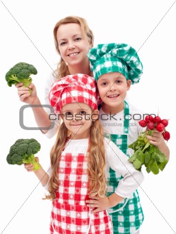 Happy family preparing healthy vegetables meal