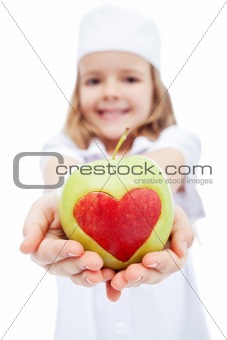 Little girl as nurse giving you an apple