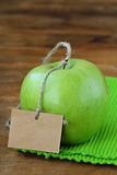 green fresh apples on a wooden background
