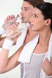 Sporty people drinking water