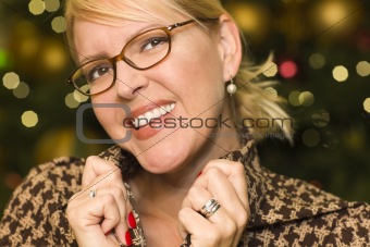 Beautiful Blonde Woman Smiling Wearing Glasses in the City Lights.