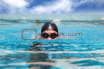man in the Swimming pool with breast stroke
