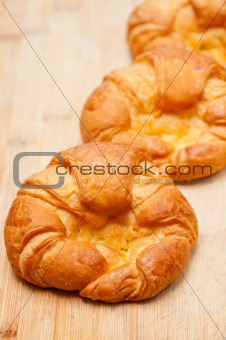fresh baked french croissant brioche on wood board