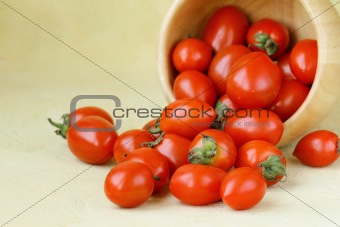 small cherry tomatoes in a wooden bowl