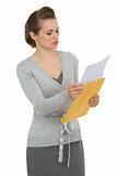 Concerned woman reading letter