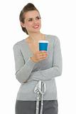 Smiling business woman with cup of coffee looking on copy space