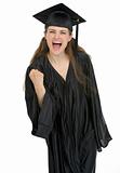 Smiling graduation student woman showing yes gesture