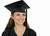 Portrait of smiling graduation girl looking on copy space