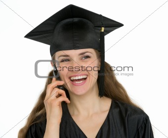 Portrait of happy graduation student woman speaking phone